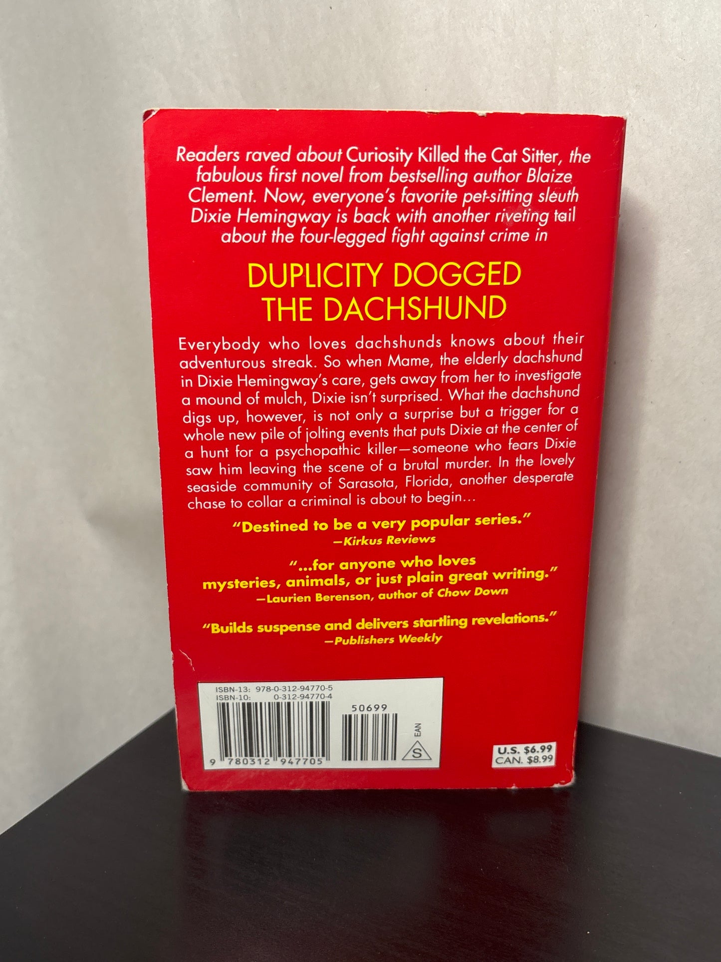 Duplicity Dogged the Dachshund by Blaize Clement (A Dixie Hemingway Mystery #2)