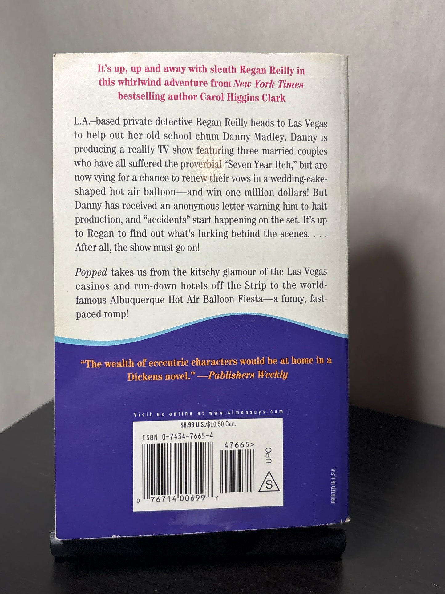 Popped by Carol Higgins Clark (Regan Reilly Mysteries #7)