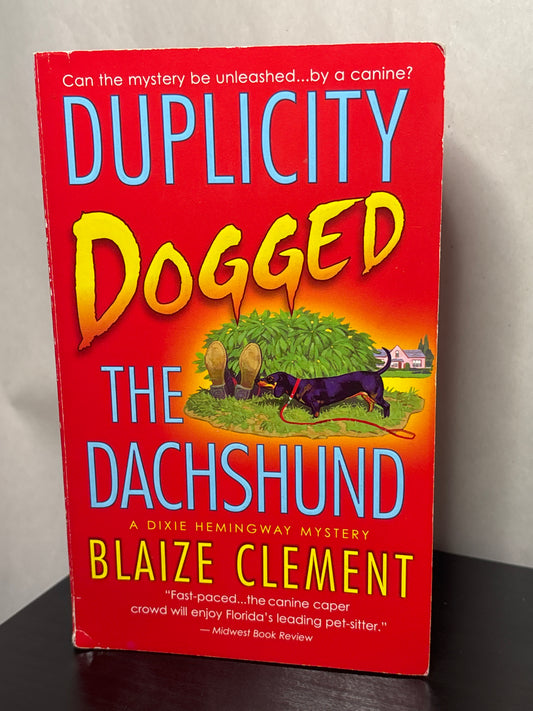 Duplicity Dogged the Dachshund by Blaize Clement (A Dixie Hemingway Mystery #2)